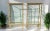 Pair of Antique Early 20th Century French Double-Sided Solid Brass and Glass Display Cabinets For Sale - Image 4 of 12