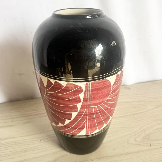 Striking studio pottery vase dated 1989 by the Curras Brothers, featuring bold black glaze with hand-carved sgraffito...