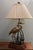 Stunning satin solid brass standing crane in its element. This gorgeous lamp features a calm crane partly hidden in the...
