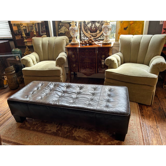 Handsome large tobacco leather ottoman having rectangular form with buttons on top. Could float in front of a sofa to use...