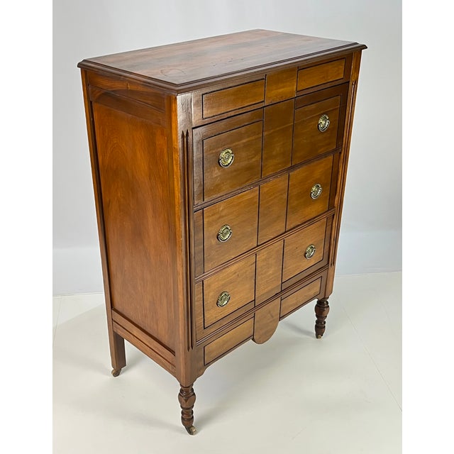 Charming 1930s four drawer chest. The facade is designed to look like a multi-drawer collector’s cabinet, but actually...