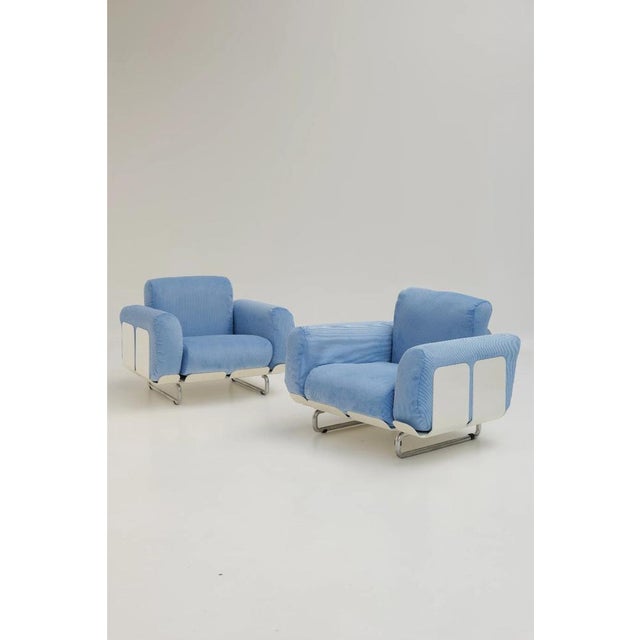 Pair of Senzafine armchairs designed by Eleonore Peduzzi Riva and produced by Zanotta. The metal frame combined with white...