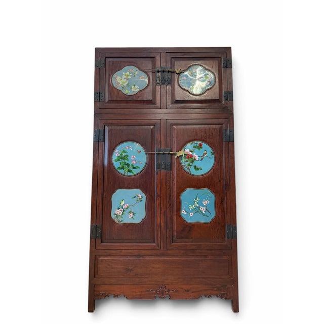 An exceptional and stately Chinese compound wedding cabinet meticulously crafted from solid, richly grained rosewood. This...
