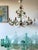 This vintage French tole chandelier is an eight-light floral ceiling light attributed to Maison Chaumette, Paris, and...