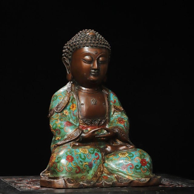 This is a finely crafted antique cloisonné enamel sculpture of Shakyamuni Buddha, the founder of Buddhism. The Buddha is...