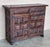 From Spain, constructed of solid walnut, the rectangular top without edge top, conforming case housing two carved drawers...