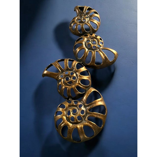 Unique Mid Century brass wall decor. Very decorative piece with a unique design and a nice tone of patina on the brass ....