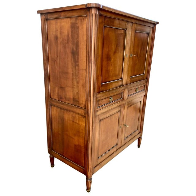 A beautiful Louis XVI style sideboard with elegant brass hardware. Dimensions: Height 160 cm, Width 105 cm, Depth 59 cm.