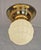 Art Nouveau ceiling lamp, circa 1915. Dish-shaped brass body. Original ivory-colored glass shade. The lamp has been...