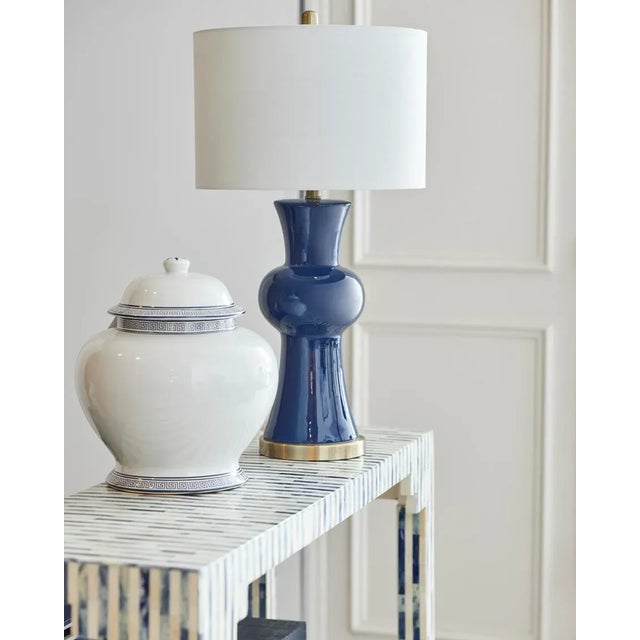 Add a mediterranean vibe to your home with our 14" greek key covered urn. Crafted of white glazed porcelain with a hand...