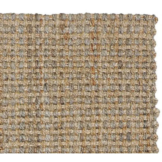 Variations in the color of the natural jute fibers add another layer of visual interest to our handwoven Costa Rica rug,...