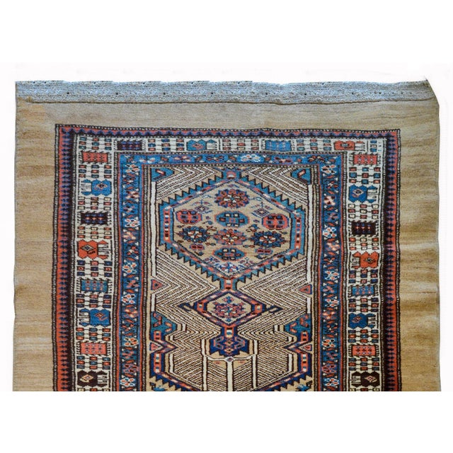 An outstanding early 20th century Persian Serab runner with an incredible pattern containing several geometric patterned...