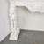 Beautifully hand-carved Carrara marble console table with seated hounds and a carved frieze with cartouche holding a...