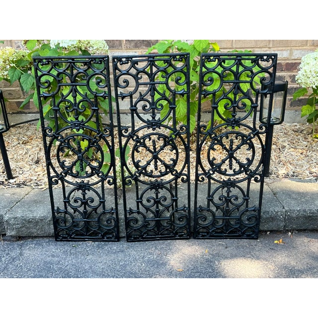 These are three wrought iron panels in the same overwork design. Each rectangular panel has elegant scrolls and geometric...