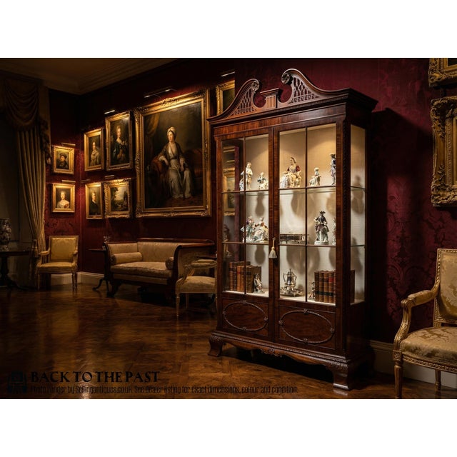 A lovely Edwardian period display cabinet in the manner of Thomas Chippendale. Well constructed in solid mahogany with...