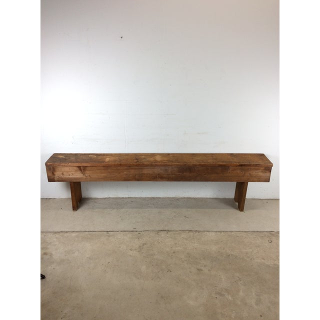 This antique primitive bench features hardwood construction, original natural finish, unique long top with reinforced side...