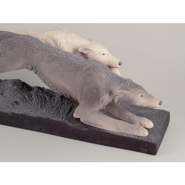 Sevres Vinsare, France. Colossal ceramic sculpture of two running greyhounds. Art Deco. Grayish and sand-colored glaze....