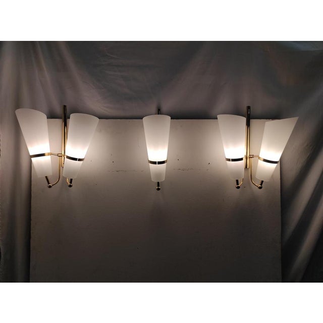 Stunning set of 3 brass and glass sconces from the 1950s. Appliques totally restored and brought to new condition. A...