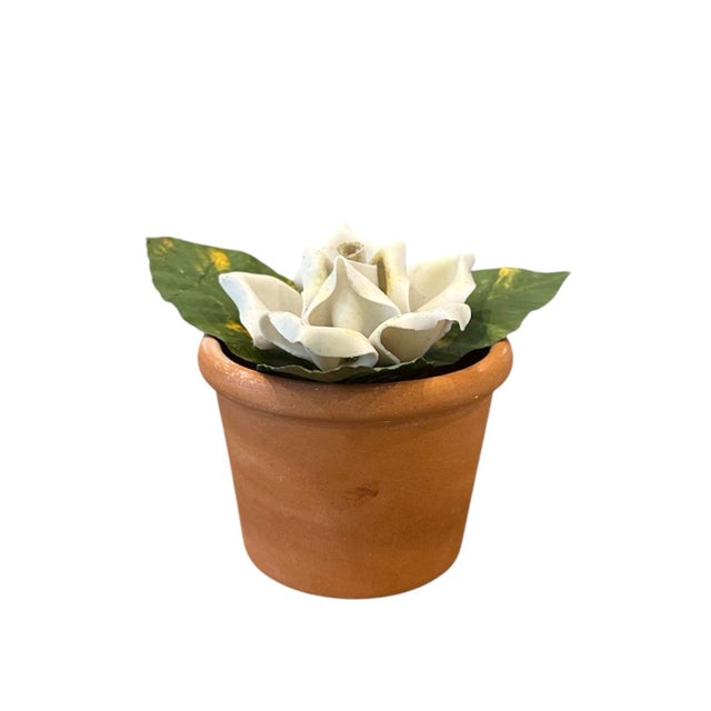 A gorgeous, vintage porcelain bisque and tole white rose. Features a single stem, hand sculpted, porcelain bisque rose...