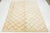 A stunning contemporary Moroccan-style wool rug, meticulously hand-knotted with a beige base and complemented by brown...