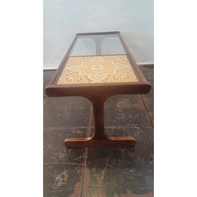 This is a nice Teak Coffee Table with tile and a glass top. Made by G-Plan E. Gomme Co. Ships from San Diego, California.