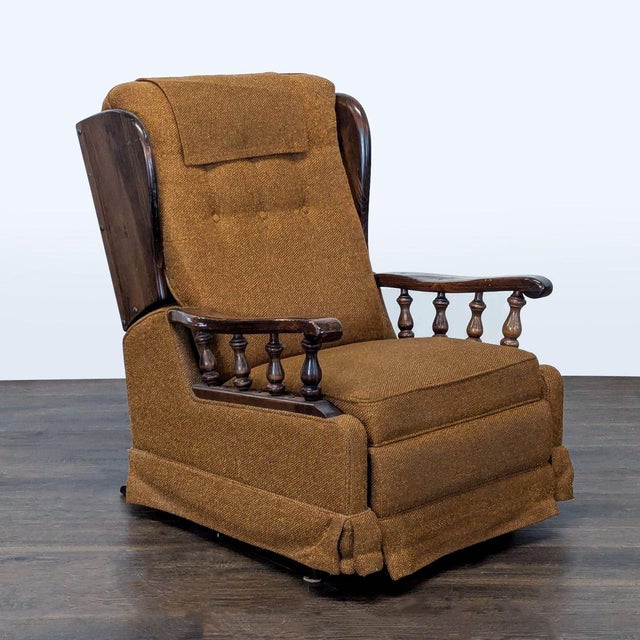 This vintage lounge chair features a cozy brown fabric, classic button-tufted back, and sturdy carved wooden armrests. The...