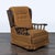 This vintage lounge chair features a cozy brown fabric, classic button-tufted back, and sturdy carved wooden armrests. The...
