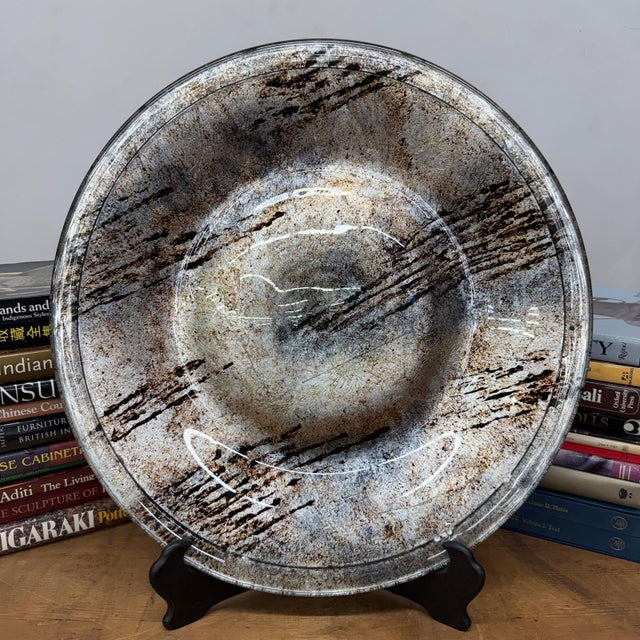 "About This Piece About This Piece This large vintage Mexican ceramic charger captures the beauty of elemental...