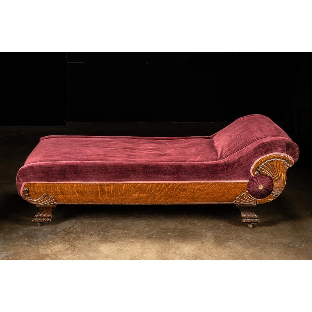 This burgundy chaise lounge features all wooden construction. The wood is quarter sawn oak, which provides a beautiful...