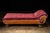 This burgundy chaise lounge features all wooden construction. The wood is quarter sawn oak, which provides a beautiful...