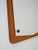 Beautiful wall mirror with a rectangular solid teak frame and a shaped internal mirror secured with metal spacers, a...