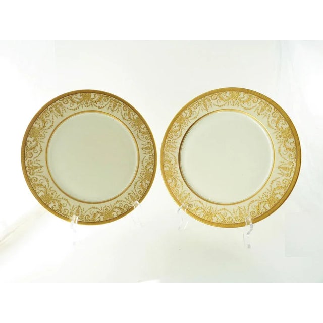 A set of six porcelain service or under-plates marked for Jean Pouyat. They have thick gold encrusted work featuring...