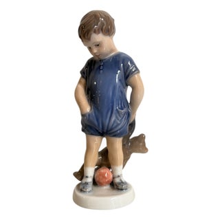Ceramic Figurine of Child with a Kitten from Royal Copenhagen, 20th Century For Sale