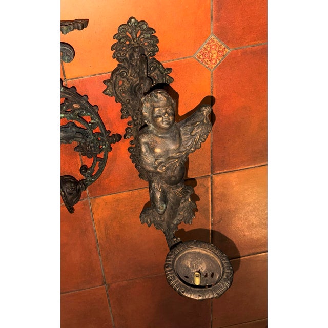 This bronze, antique pair of sconces is amazingly beautiful! They would be gorgeous as indoor lighted sconces or outdoors...