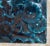 Early 20th century 'Arts and Crafts' style botanical monochromatic relief glazed ceramic tile in a deep inky blue. One-of-...