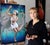 This oil painting on Belgian linen captures a dancer in a moment of graceful movement, her body adorned in delicate...