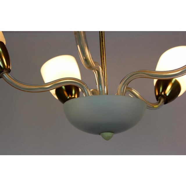 This Mid-Century Modern ceiling lamp was produced in the 1960's in Czechoslovakia. It is made of steel and glass, the lamp...