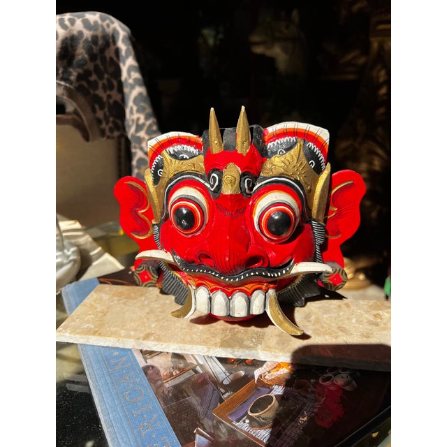 Up for consideration is a beautiful vintage Balinese Barong Rangda mask art piece on a stone stand. This would look lovely...