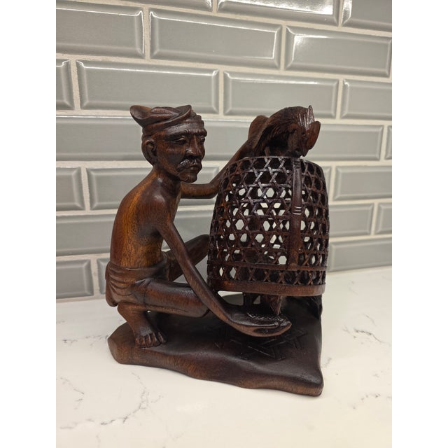 An extraordinary, highly complex mid-century Balinese expressionist realism genre sculpture depicting a traditional...