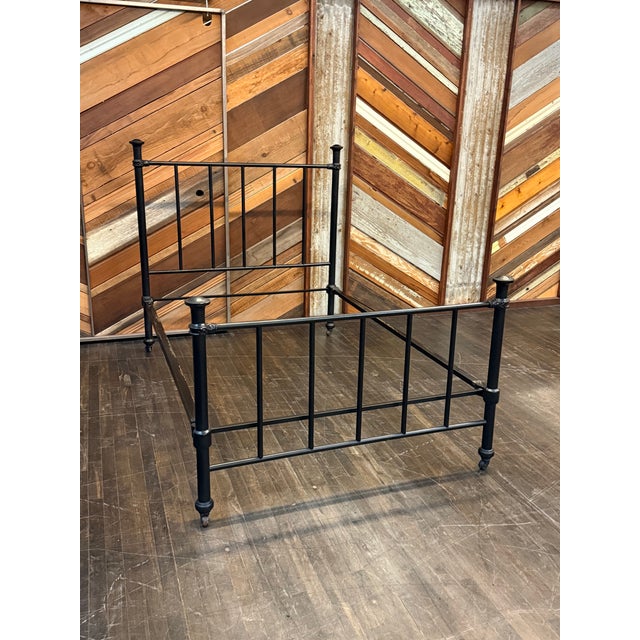 Design Plus Gallery presents a Full Size Iron Bed Frame. This antique iron bed frame is built with slender rod detailing...