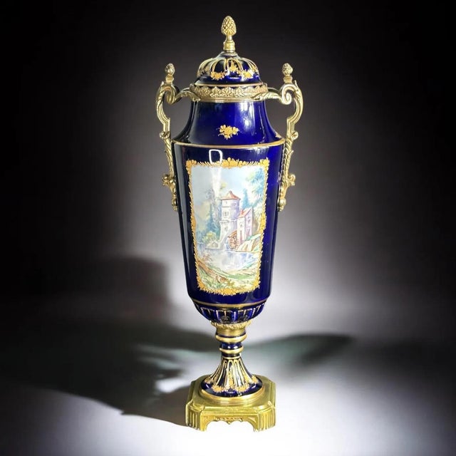 Sèvres style porcelain vase An exquisite French porcelain vase, richly decorated in cobalt blue with lavish gilt detailing...