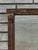 The product is a 1920 regency style walnut mirror, featuring a rectangular shape with a brown color and a mirrored frame...
