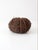 Sculptural vintage grapevine pumpkin crafted from tightly bundled natural vines, with thicker strands defining its rounded...