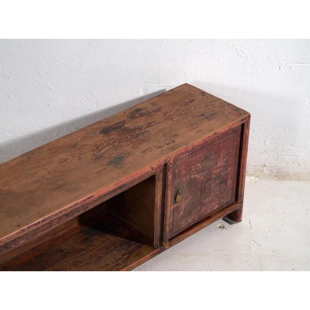 Antique low sideboard in pine wood, chinese provincial furniture originating from gansu and dated circa 1930. Originates...