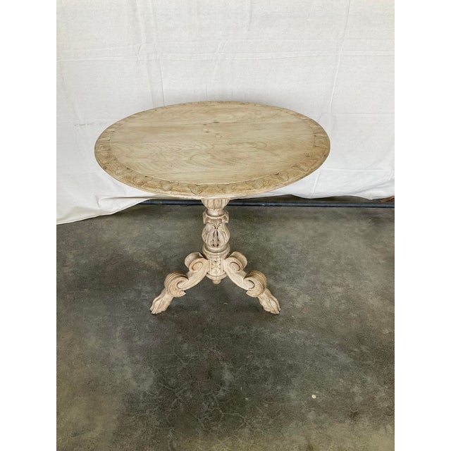Antique Bleached Carved Oak Side Table with hoof feet 19th Century in good estate condition. The top has a slight bow and...