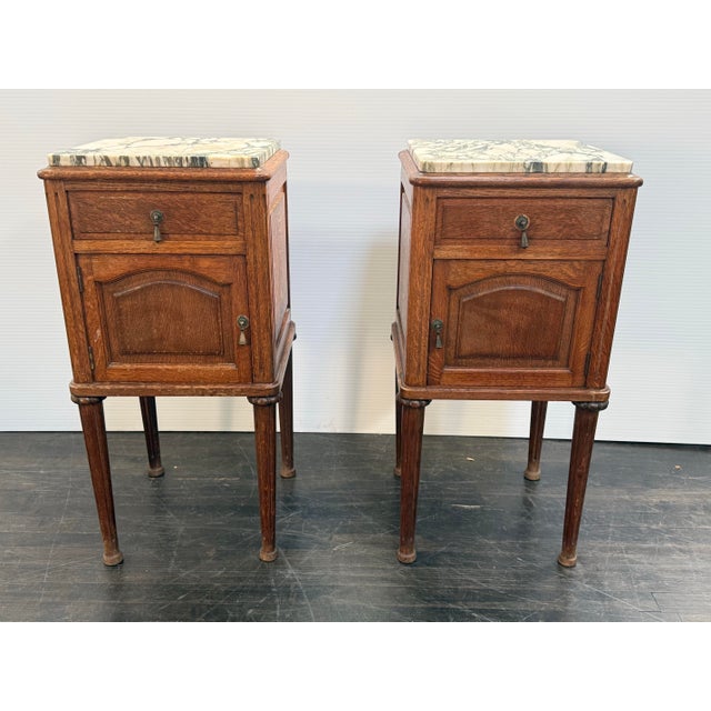 Design Plus Gallery presents a Pair of Antique Nightstands with Louis XVI Style. These bedside table have detailed...