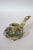 A late 19th-century French chamberstick in gilt brass, richly decorated with champlevé enamel and set with a green onyx...
