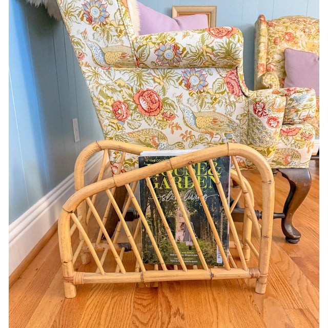 Simple and modern vintage asymmetrical Hollywood Regency style bent burnt bamboo magazine rack. This piece is a great...