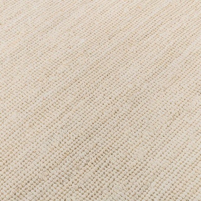 Hand woven ivory boucle inspired soft jute rug. Available in numerous sizes. Please note that its appearance may vary...