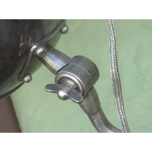 Amazing heavy chrome floor lamp composed of Vintage industrial metal parts with motorcycle or Vintage car headlight. This...